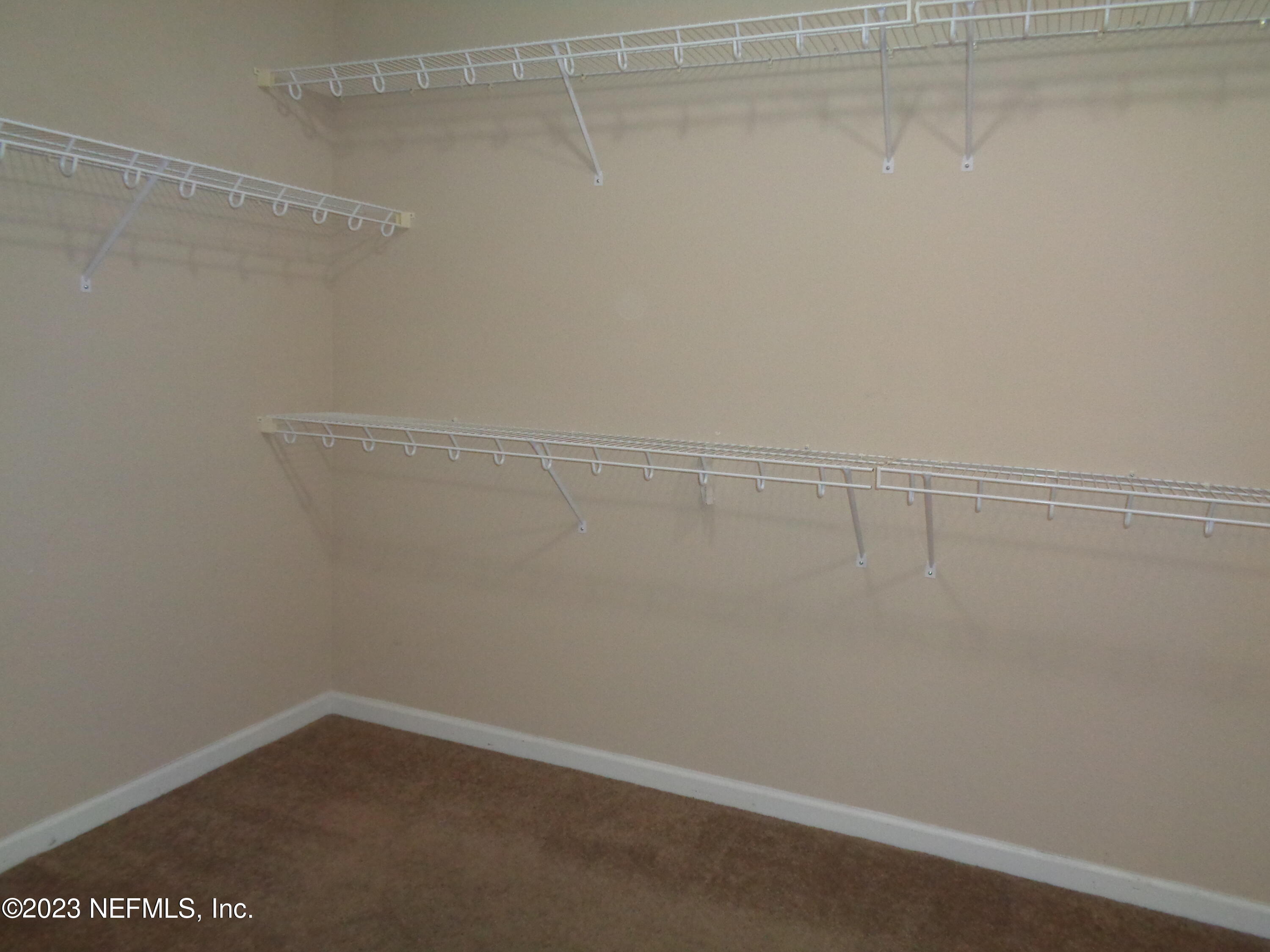 3786 Chasing Falls Road Orange Park, FL 32065 - Photo 20 of 26 a view of a room with racks on the wall