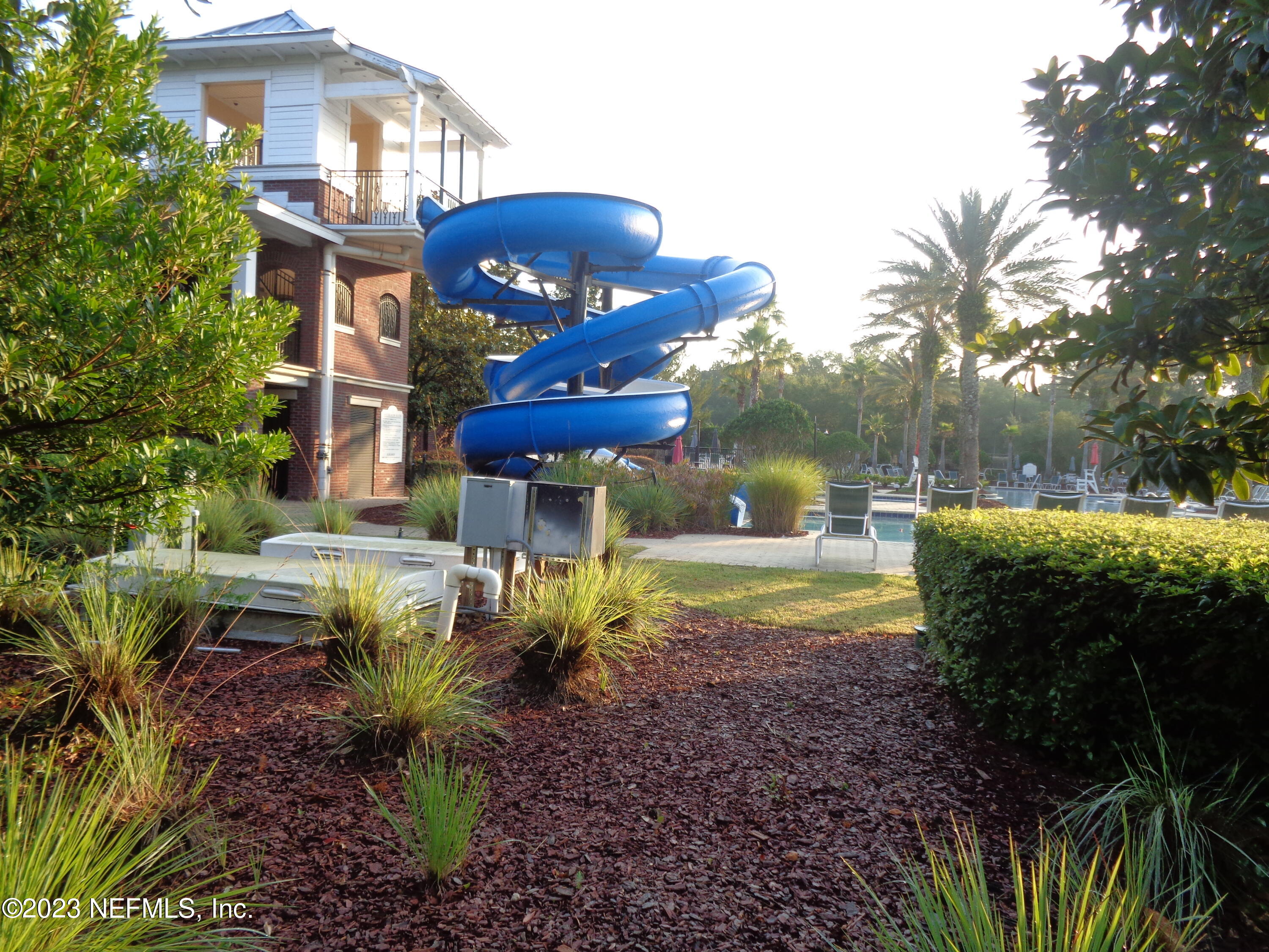 3786 Chasing Falls Road Orange Park, FL 32065 - Photo 23 of 26 a view of a house with a yard and sitting area