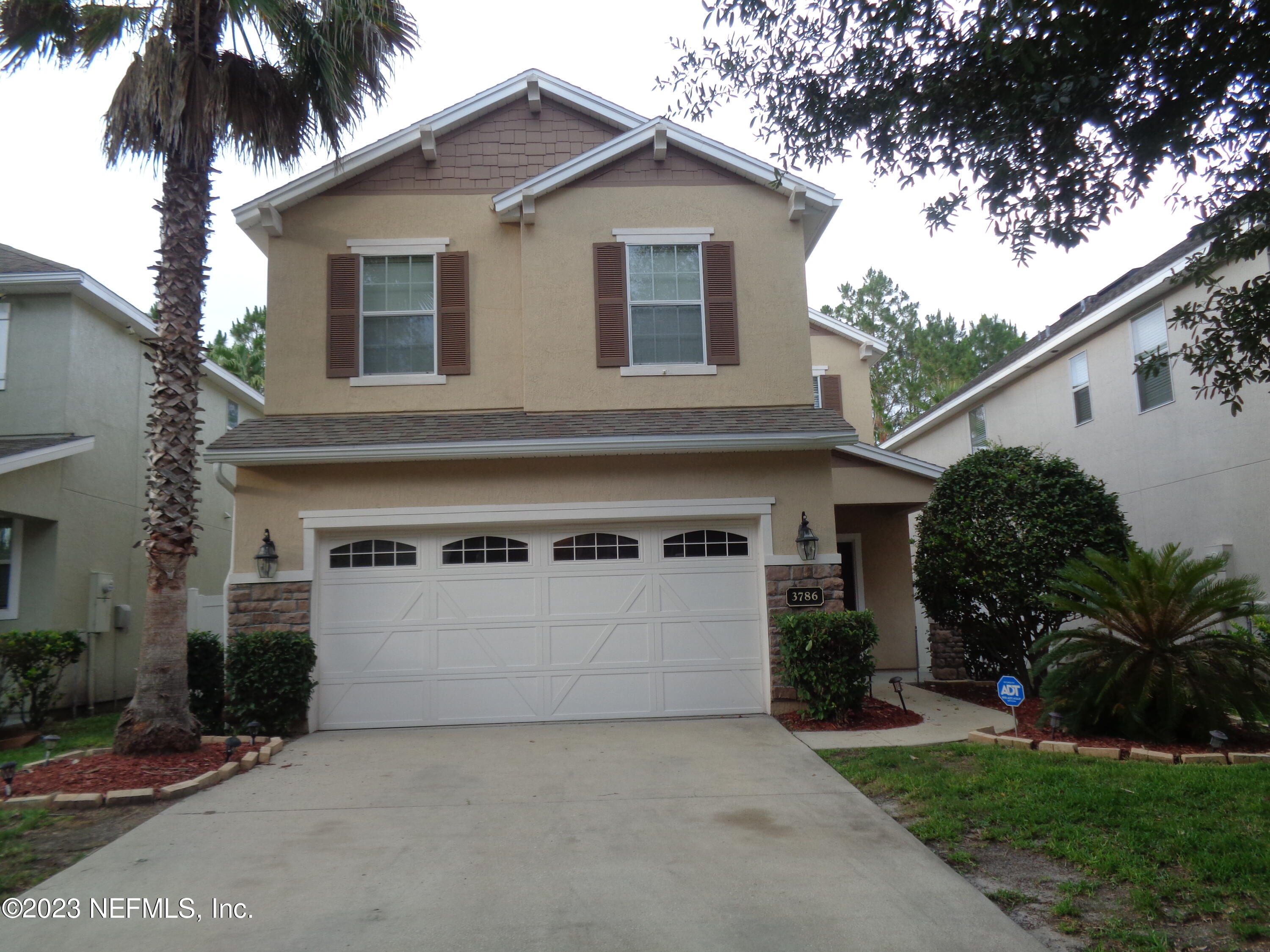 3786 Chasing Falls Road Orange Park, FL 32065 - Photo 3 of 26 a view of a house with a yard plants and palm tree