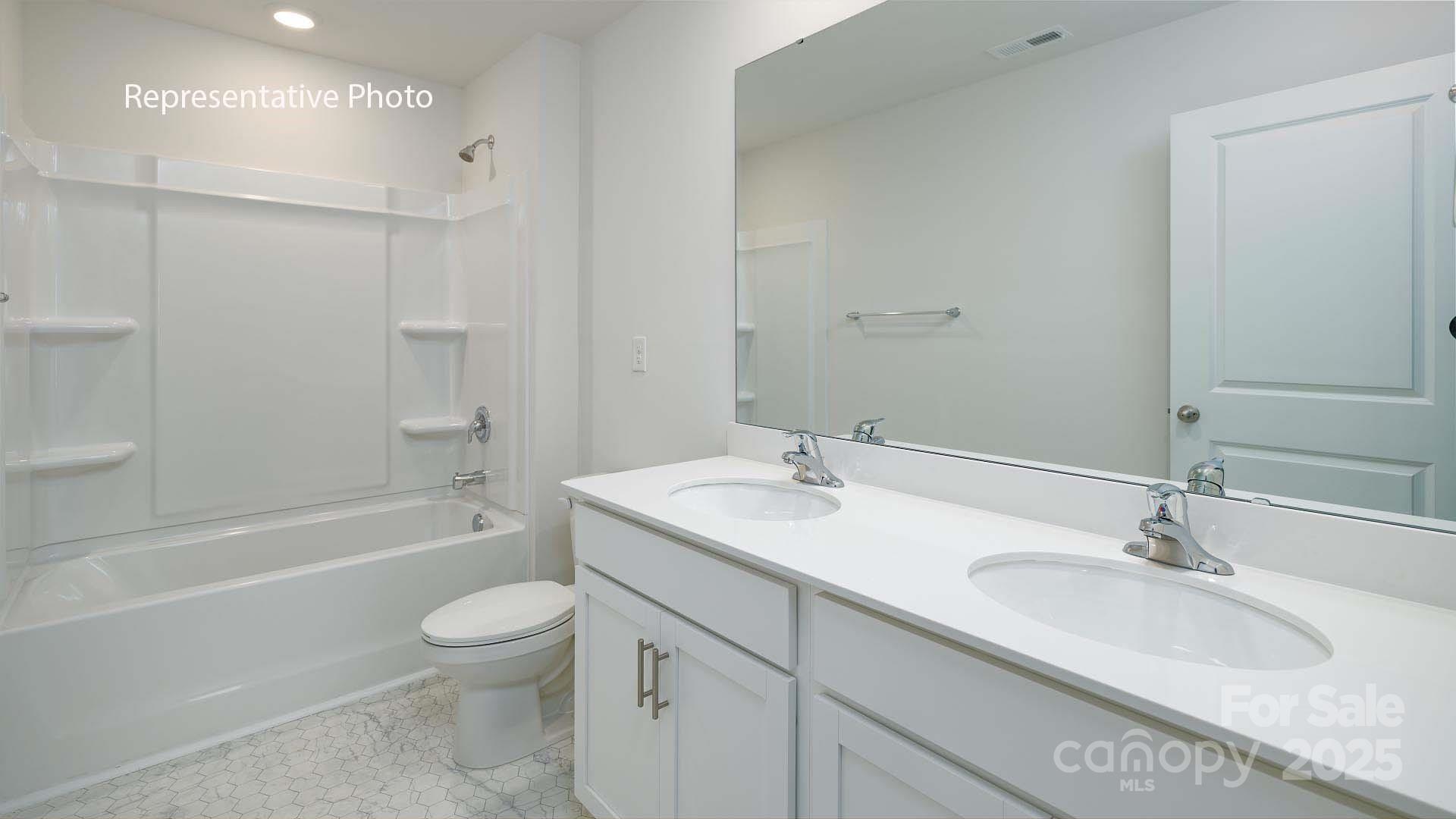 2671 Goose Fair Road Maiden, NC 28650 - Photo 19 of 28 a bathroom with a granite countertop sink a toilet and bathtub