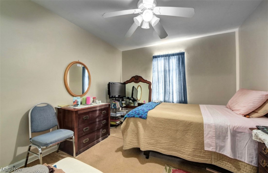15902 Munn Road Cleveland, OH 44111 - Photo 20 of 27 Carpeted bedroom with ceiling fan