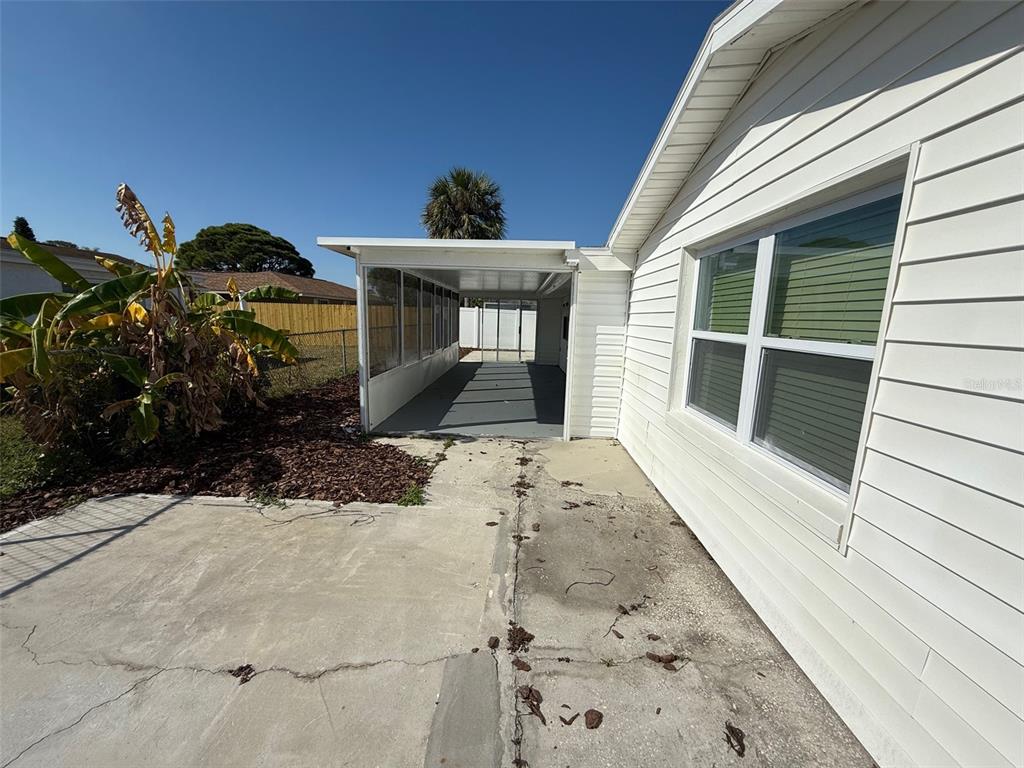 6104 Seabreeze Drive Port Richey, FL 34668 - Photo 20 of 25 a front view of a house with a yard