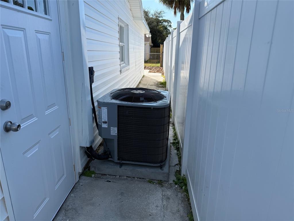 6104 Seabreeze Drive Port Richey, FL 34668 - Photo 24 of 25 a room with a door and a window
