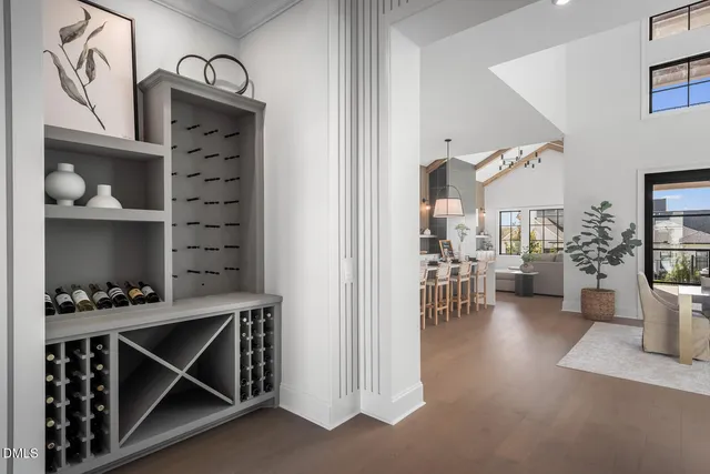 a view of center kitchen island with a sink furniture and a chandelier