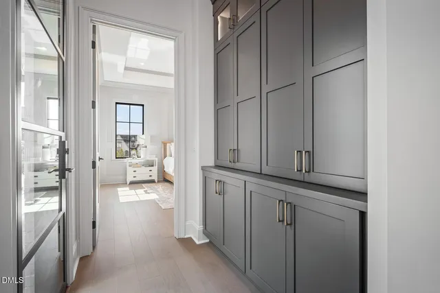 a dining room with furniture a rug and wooden floor