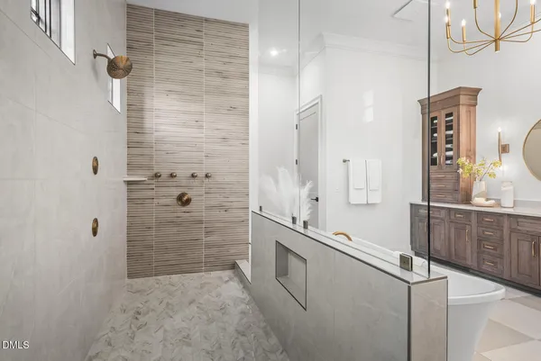 a bathroom with a granite countertop bathtub a sink and a mirror