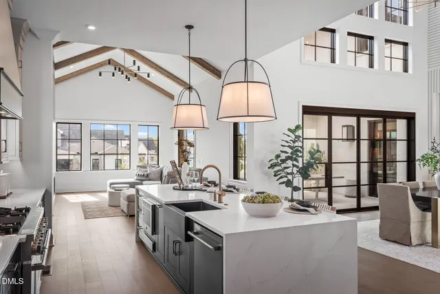 a large kitchen with a table and chairs