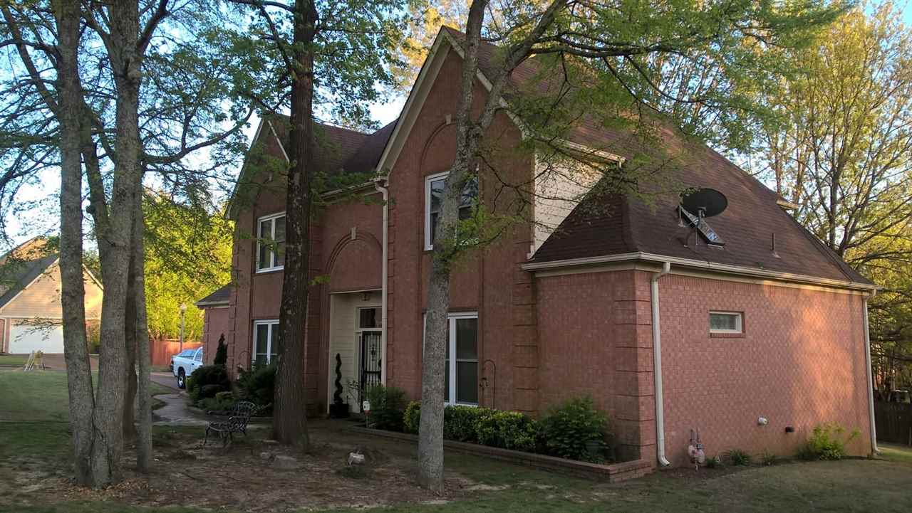 8835 Raspberry Lane Memphis, TN 38016 - Photo 1 of 1 a view of a house with a yard