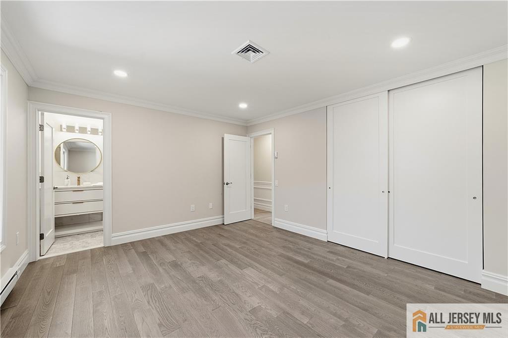 780 Ardmore Road, Unit 780B Monroe Township, NJ 08831 - Photo 16 of 30 wooden floor in an empty room with a window
