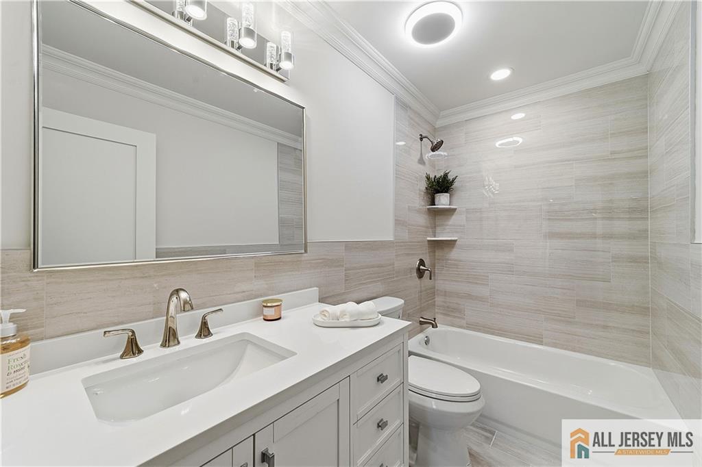 780 Ardmore Road, Unit 780B Monroe Township, NJ 08831 - Photo 20 of 30 a bathroom with a sink a toilet and shower
