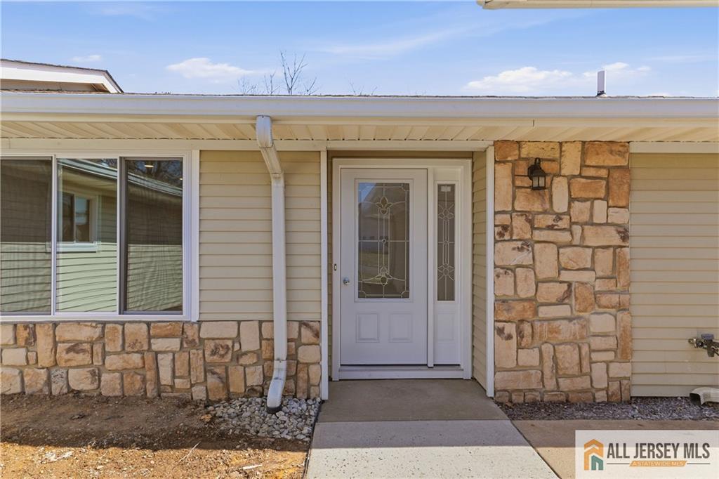 780 Ardmore Road, Unit 780B Monroe Township, NJ 08831 - Photo 2 of 30 a view of a brick house with a glass door