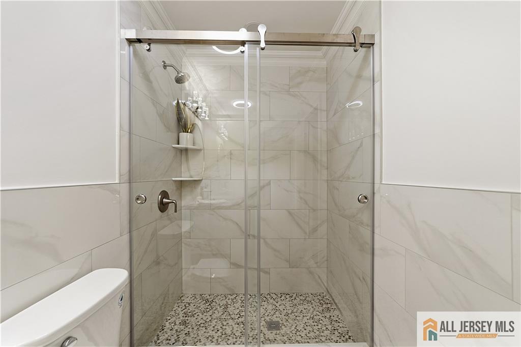 780 Ardmore Road, Unit 780B Monroe Township, NJ 08831 - Photo 21 of 30 a bathroom with a shower and toilet