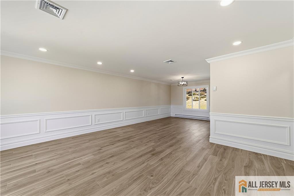 780 Ardmore Road, Unit 780B Monroe Township, NJ 08831 - Photo 3 of 30 an empty room with wooden floor and windows