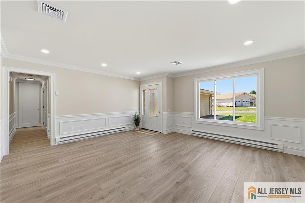 780 Ardmore Road, Unit 780B Monroe Township, NJ 08831 - Photo 4 of 30 an empty room with wooden floor and window