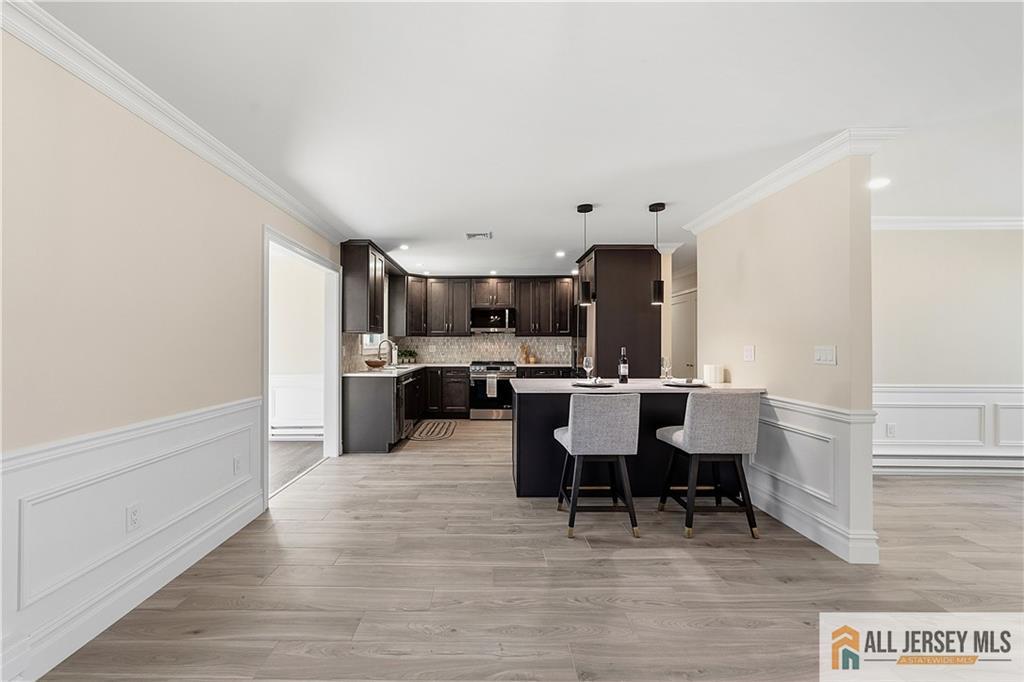 780 Ardmore Road, Unit 780B Monroe Township, NJ 08831 - Photo 6 of 30 a view of a dining room with furniture and wooden floor