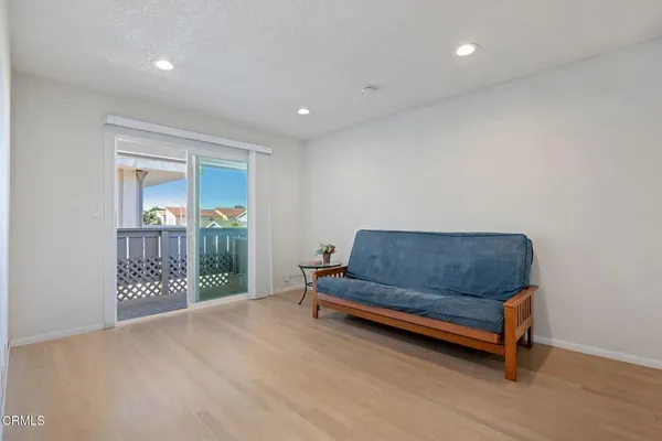 a living room with furniture and a gate