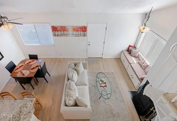 a view of a room that has a couch and a table in it