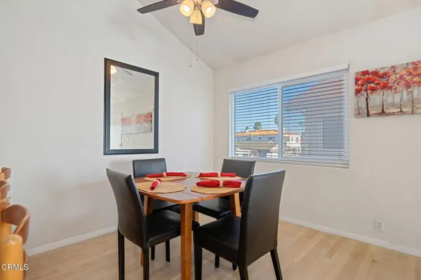 a dining room with furniture and window