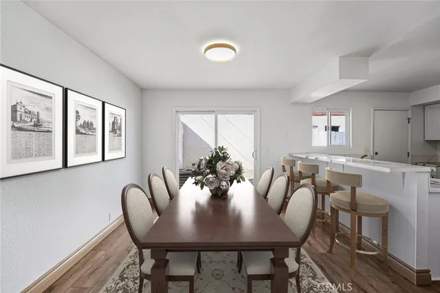a view of a dining room with furniture and window