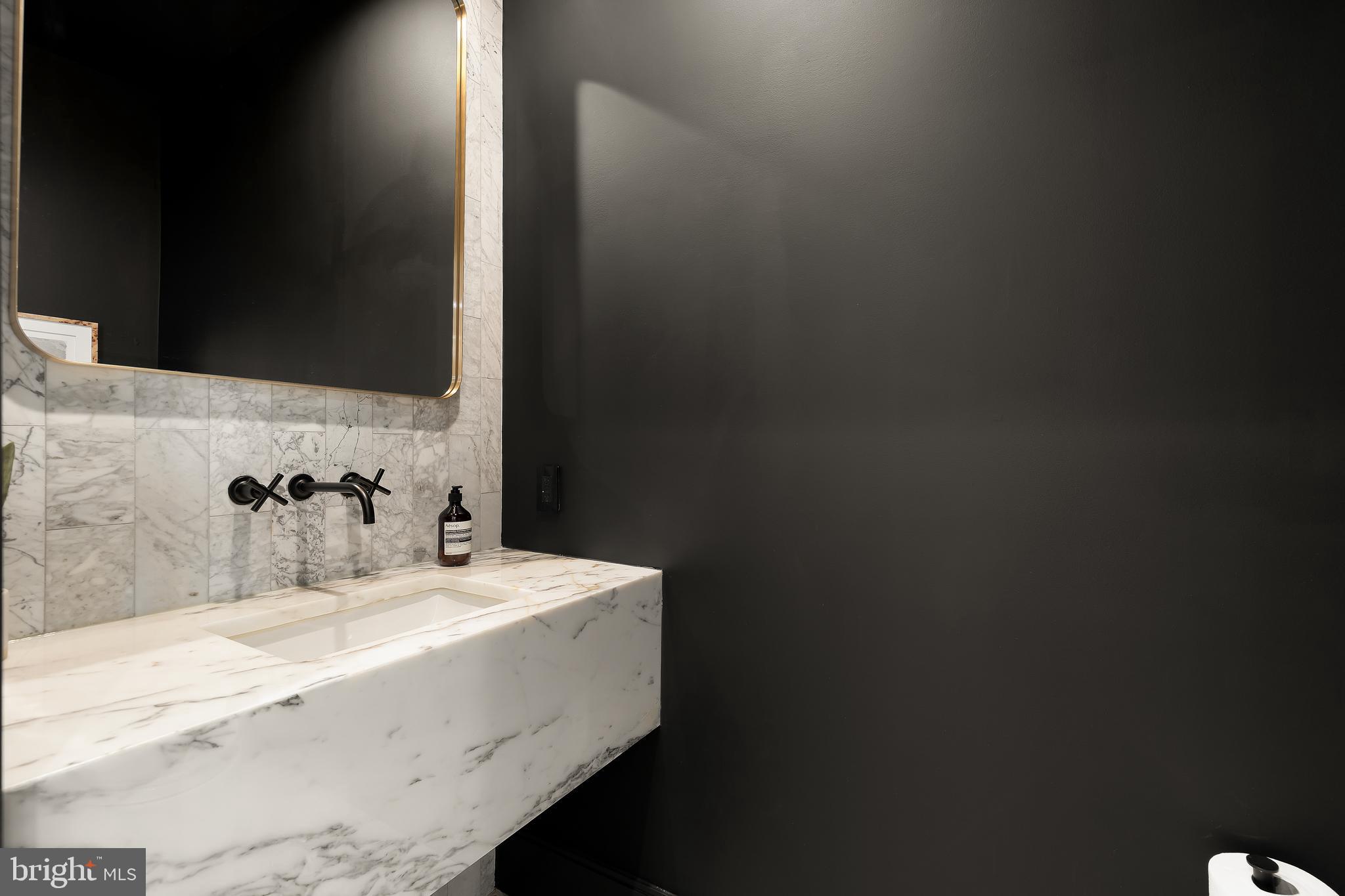 2534 11th Street Northwest, Unit 2 Washington, DC 20001 - Photo 20 of 50 a bathroom with a sink and a mirror