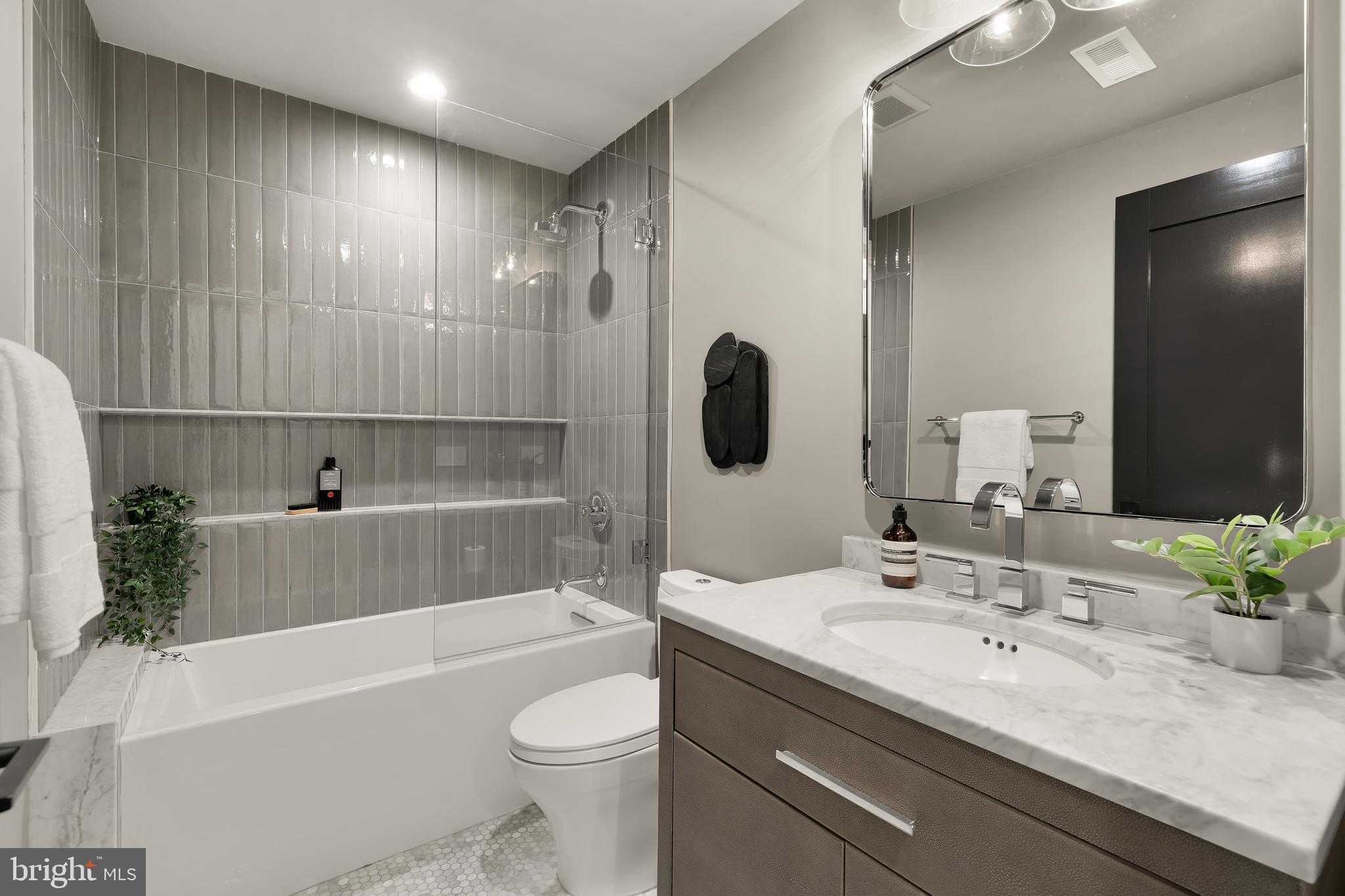 2534 11th Street Northwest, Unit 2 Washington, DC 20001 - Photo 25 of 50 a bathroom with a bathtub shower sink and toilet