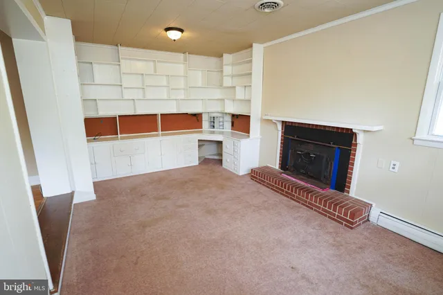 a view of livingroom with furniture and fireplace