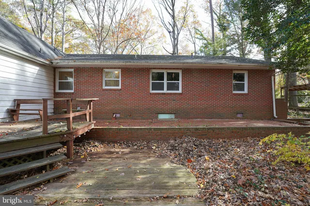 a backyard of a house with barbeque oven