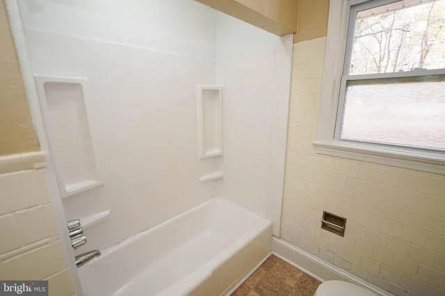 a bathroom with a bathtub
