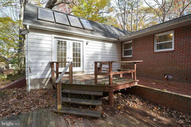 a view of a chairs and table in the backyard