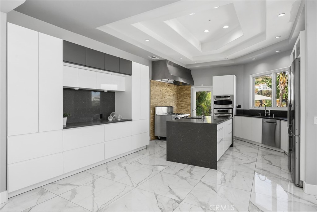 22 Cresta Del Sol San Clemente, CA 92673 - Photo 14 of 70 Do you like to cook? This is a cheifs dream, the door leads to the yard making it easy for extending you indoor cooking to the outdoors.