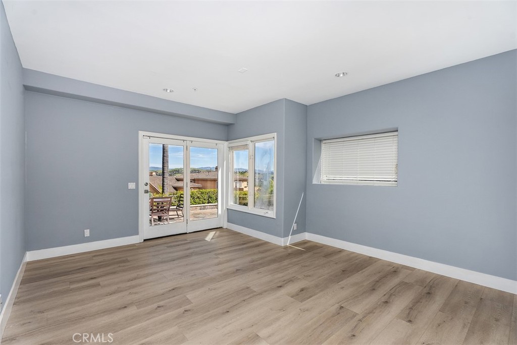 22 Cresta Del Sol San Clemente, CA 92673 - Photo 34 of 70 Bedroom closest to the laundry room, from the outdoor patio, you have a peak-a-boo ocean view to the right. and a water feature outside in the corner just below the window with the view.