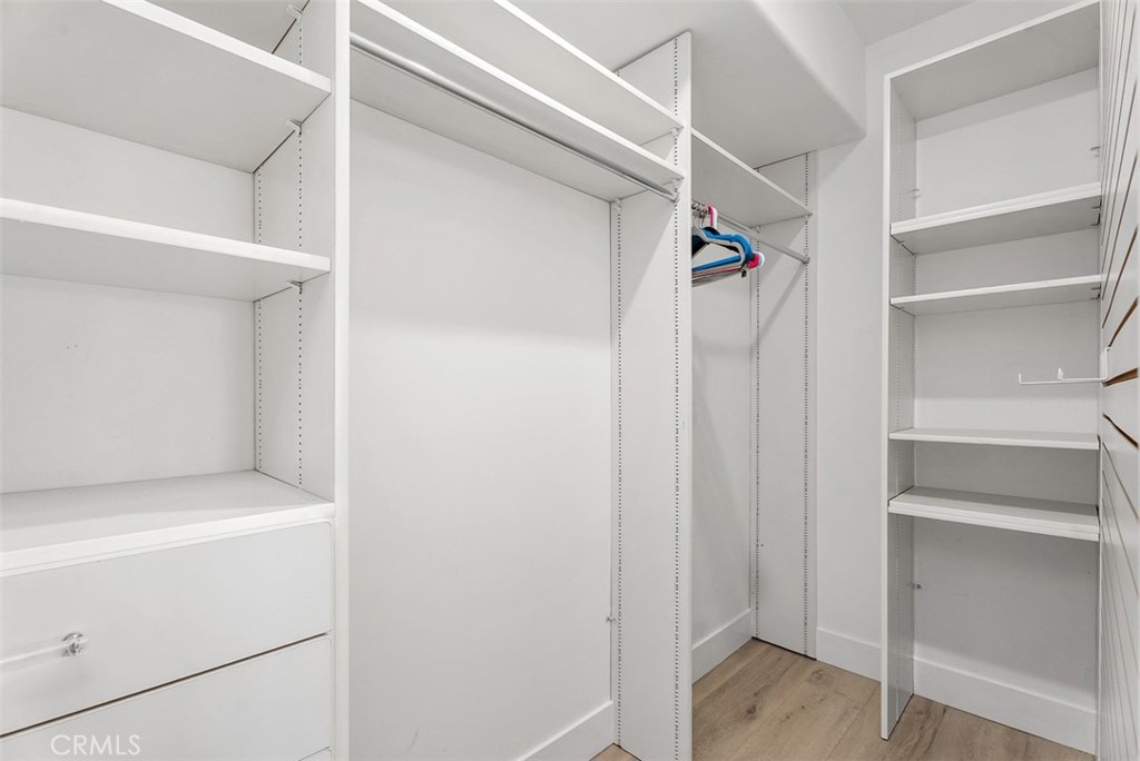 22 Cresta Del Sol San Clemente, CA 92673 - Photo 40 of 70 Walk-in closet in the third bedroom downstairs with built-ins. Lots of space and stoage.