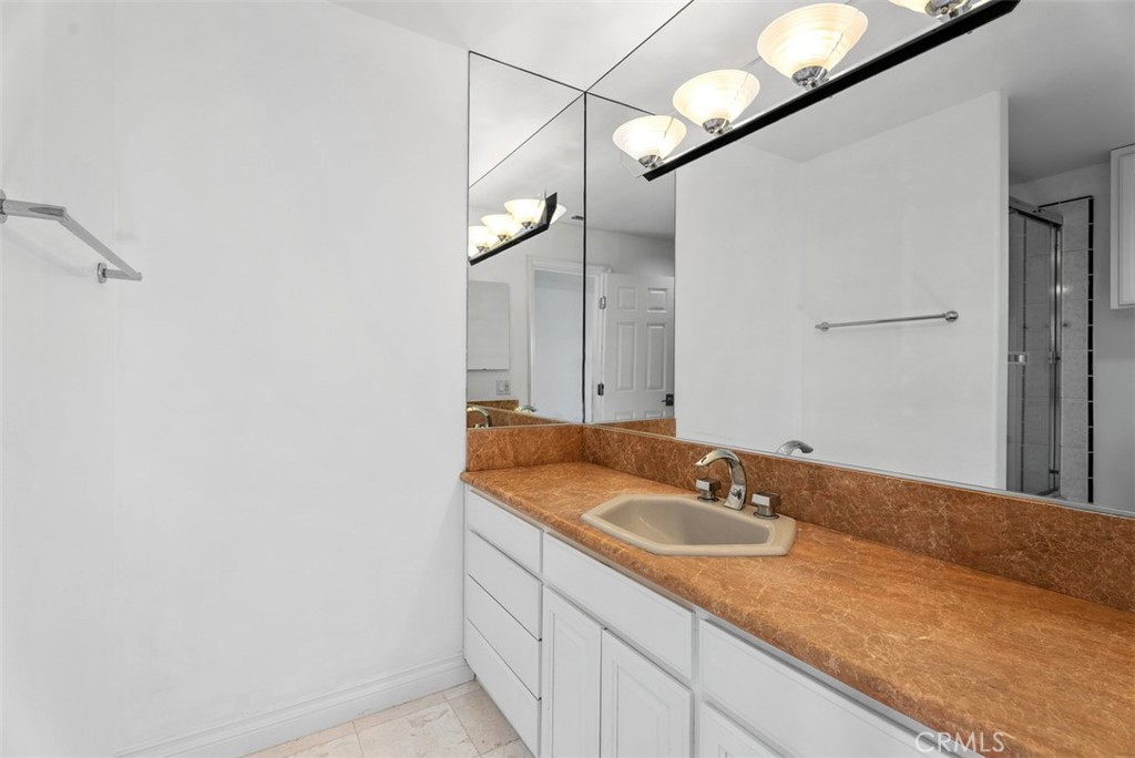 22 Cresta Del Sol San Clemente, CA 92673 - Photo 41 of 70 Third downstairs bedroom with private full bathroom. Each downstairs bedroom has it's own bathroom in the bedroom and access to the outside patio on the cul-de-sac street with views.