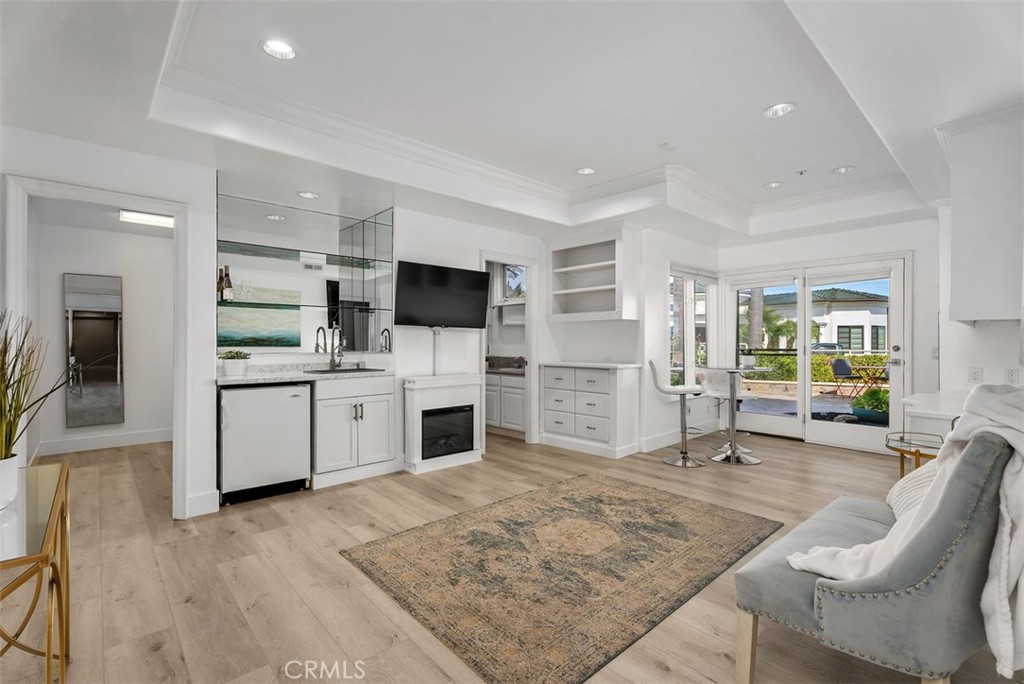 22 Cresta Del Sol San Clemente, CA 92673 - Photo 42 of 70 Fourth downstairs bedroom is a suite with sink, refrigerators, electric fireplace, built-in drawers, shelves and cabinets, private full bathroom and an extreamly large walk-in closet. Perfect for a family member that needs privacy.