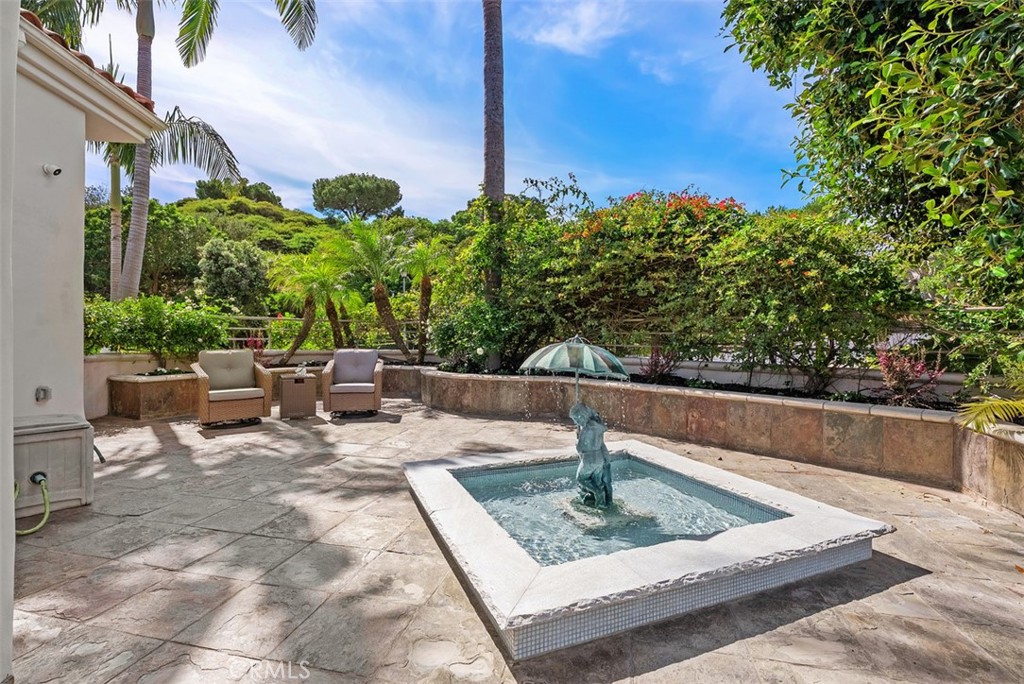 22 Cresta Del Sol San Clemente, CA 92673 - Photo 45 of 70 This water feature is off the kitchen and visable from the diningroom and can be enjoyed anytime while entertaining from this magnificant outdoor extended kitchen space.
