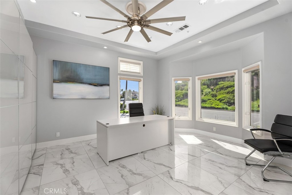 22 Cresta Del Sol San Clemente, CA 92673 - Photo 8 of 70 As you enter to the right is a spacious office space with built-ins from one wall to the next, overlooking wonderfully landsaped hillsides, high windows with plenty of natural lighting. Shades retract all the way up to capture the full effect, if you want more privacy they can be completely closed but will still allow natural light.