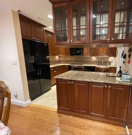 a kitchen with a stove and a refrigerator