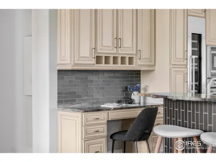 a kitchen with stainless steel appliances a sink and cabinets