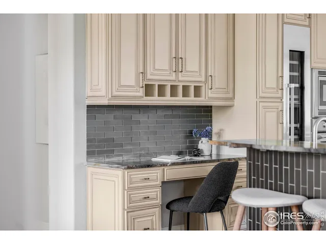 a kitchen with stainless steel appliances a sink and cabinets