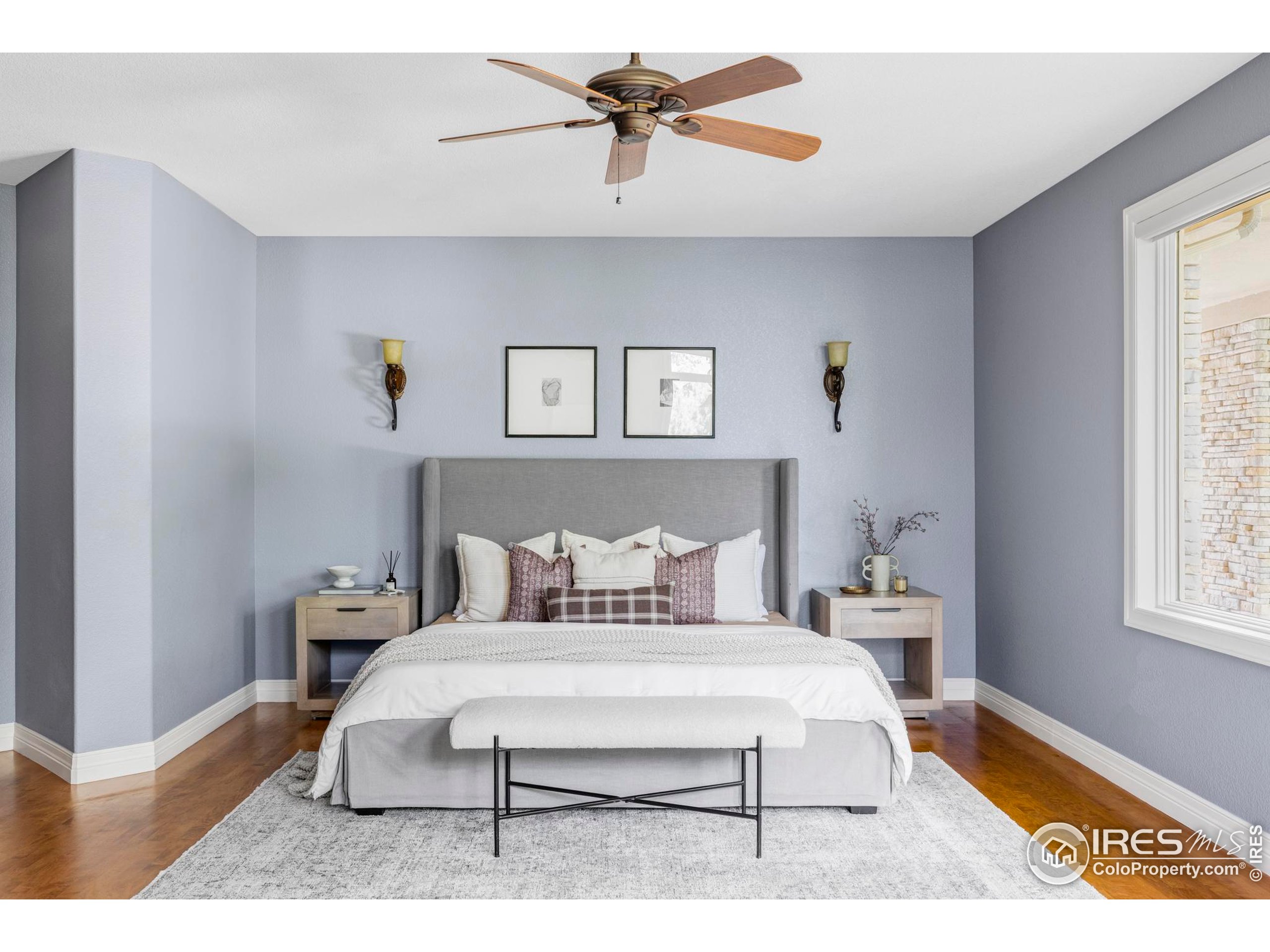 9022 Jason Court Boulder, CO 80303 - Photo 17 of 36 a bedroom with a bed a window and chandelier