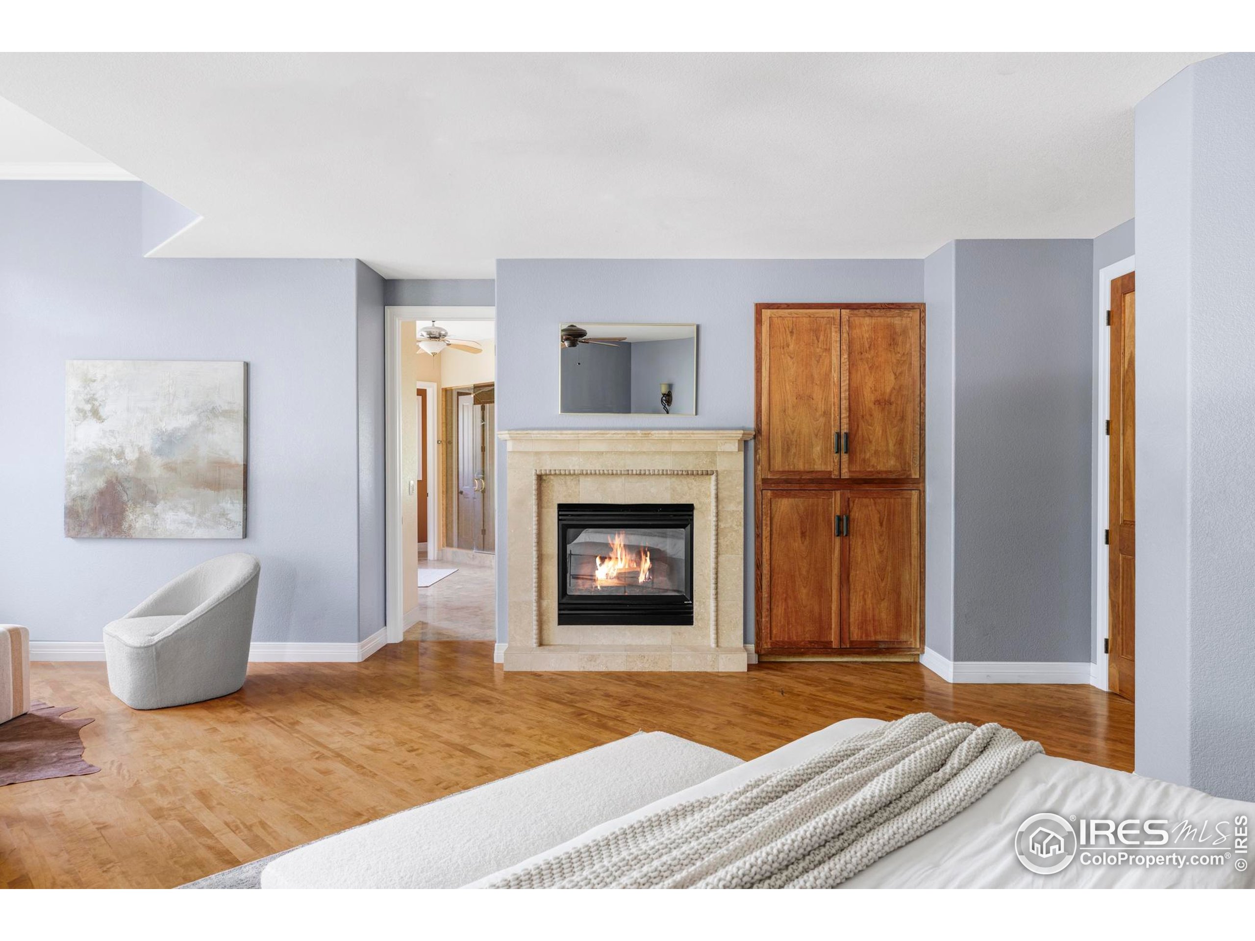 9022 Jason Court Boulder, CO 80303 - Photo 18 of 36 a bedroom with a bed and a fireplace