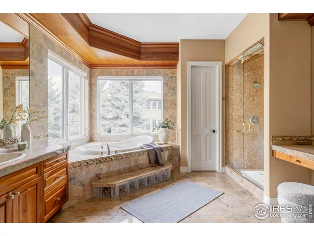 a spacious bathroom with a tub shower and sink