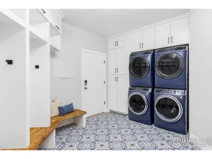 a utility room with sink dryer and washer