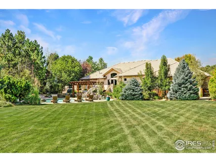 a view of a field with an trees