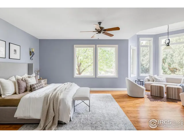 a bedroom with two beds and a chandelier