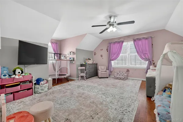 a view of a livingroom with furniture and a flat screen tv