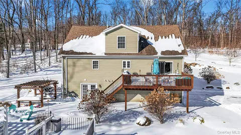 a view of a chairs and table in the patio