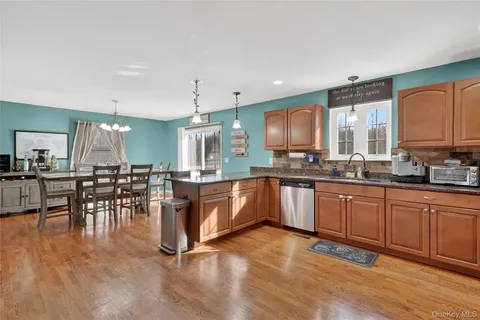a large kitchen with lots of counter space a sink and appliances