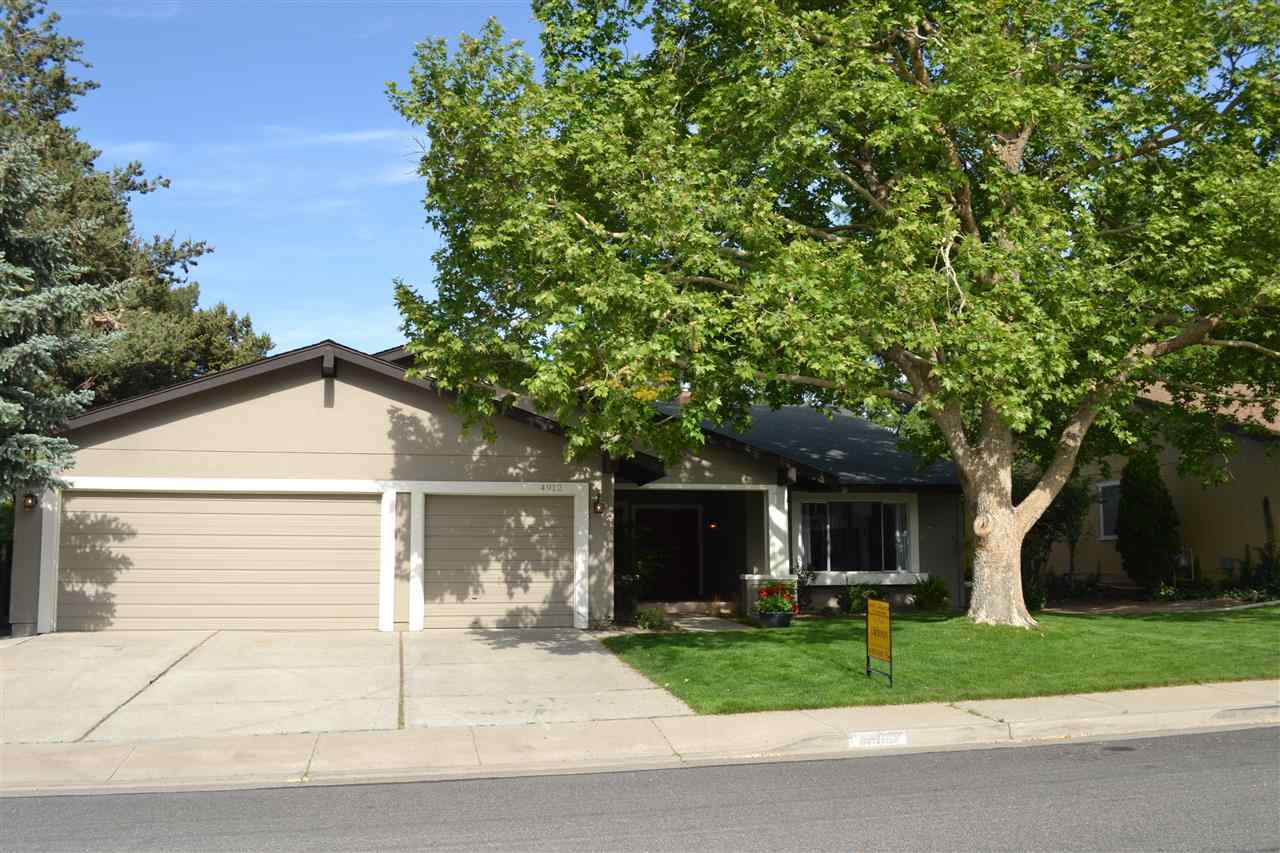 4912 Meadow Reno, NV 89509 - Photo 1 of 1 a front view of a house with a yard and garage