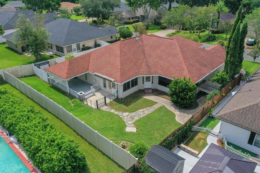 2310 Southeast 22nd Loop Ocala, FL 34471 - Photo 54 of 66 an aerial view of a house with a garden